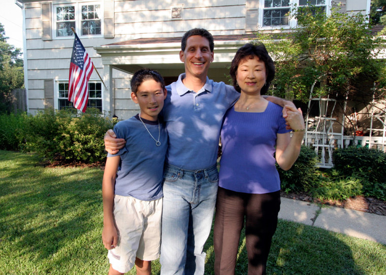 Richard Cohen, center, with wife, Jae Sook Cohen, and son Alfred Cohen, 10 at their home in Bowie, Md. Richard Cohen is a reparative therapist for homosexuals who want to become straight.