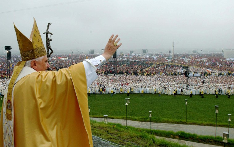 Pope Benedict waves to faithful as he arrives for the concluding Mass of the World Youth Day at the Marienfeld near Cologne