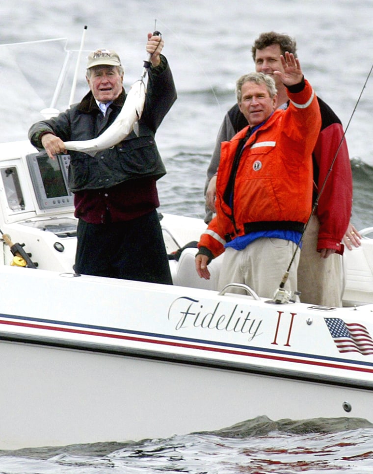 US President George W. Bush (R front) wa