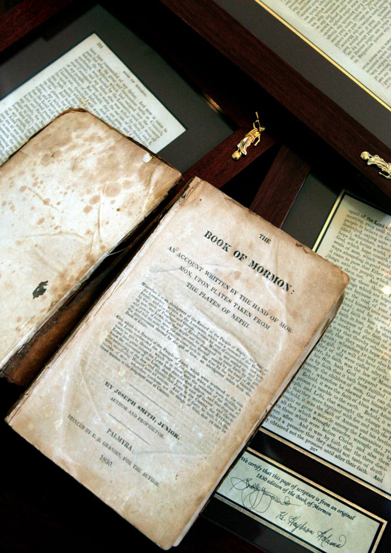 An 1830 first-edition Book of Mormon and a selection of framed individual pages owned by retired bookstore owner Helen Schlie are displayed at her home Friday, Aug. 19, 2005, in Gold Canyon, Ariz. Schlie, 82, hopes to spread the spirit of her 1830 first-edition Book of Mormon one page at a time. Each page, however, will run you $2,500 to $4,500. While Schlie hopes her fellow Mormons clamor to buy a page from the revered book, her decision to break apart a complete copy of the sacred scripture has garnered mixed reviews from the church, fellow Mormon book dealers and librarians who think such a rare piece of church history is better left whole. (AP Photo/Matt York)