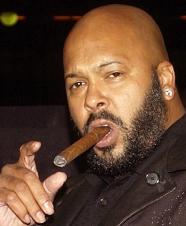 File photo of rap mogul Marion \"Suge\" Knight posing as he arrives at a film premiere in Los Angeles