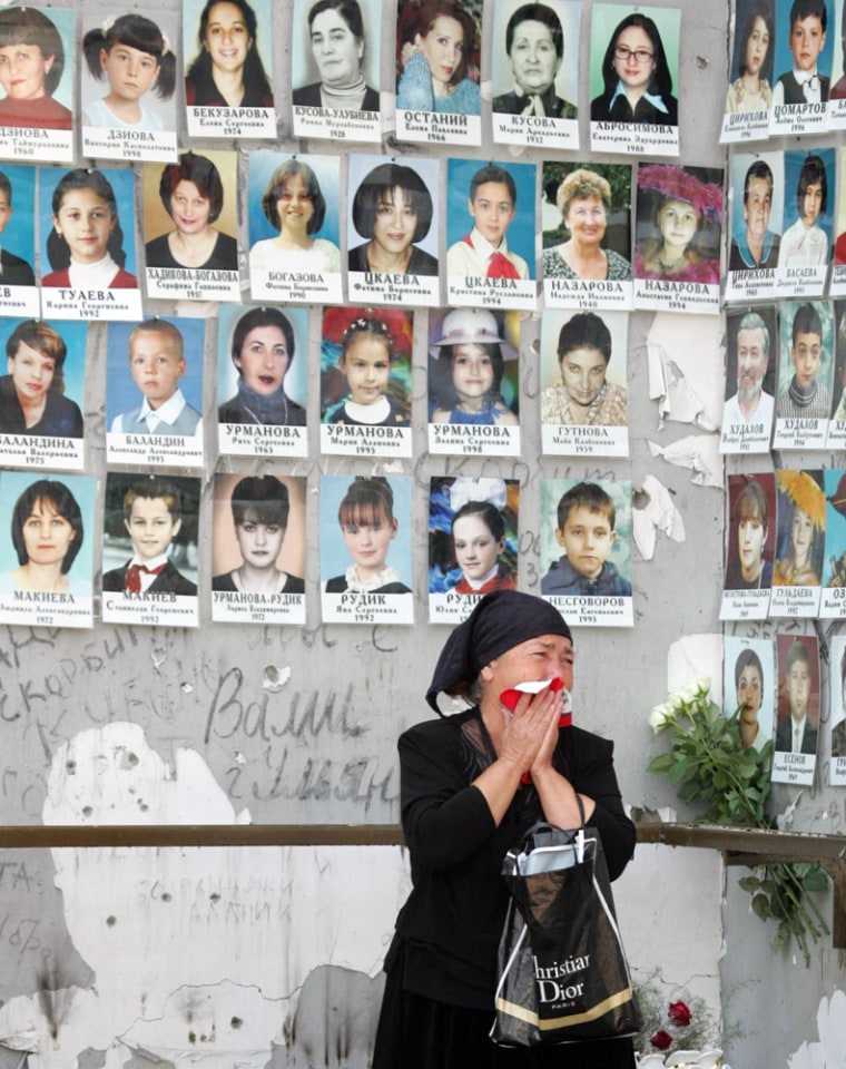 A relative grieves at Beslan school No1 during commemoration of the victims of the school siege