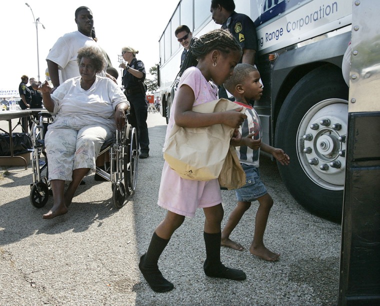 Hurricane Katrina evacuees from New Orleans board a bus to be taken to a shelter in Dallas, after going through a security screening center in Mesquite, Texas, on Saturday.