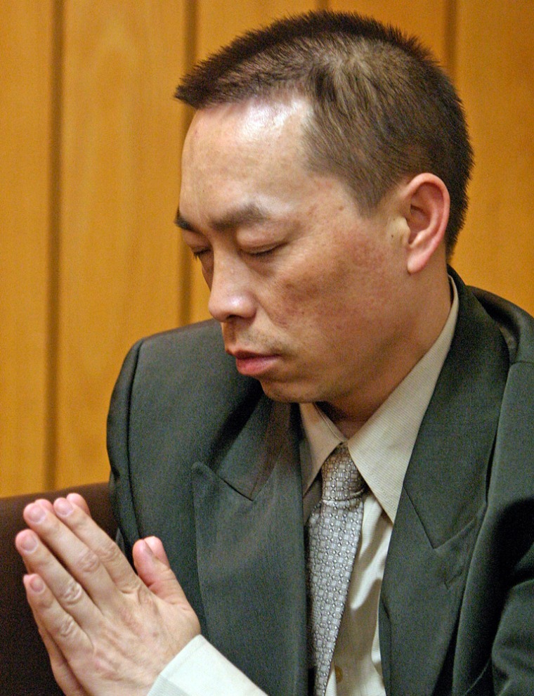 Chai Soua Vang prays during his murder trial Friday in Hayward, Wis. Vang was convicted on six counts of first-degree murder and two counts of attempted murder in 2004 shootings in isolated Wisconsin woods.
