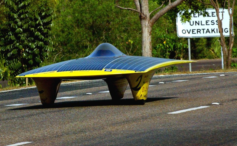 The Momentum solar car from University of Michigan drives south from Darwin after the start of the World Solar Challenge