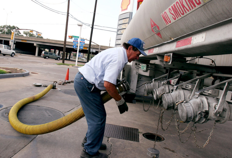 Joe Salazar makes his last stop of the day as he delivers gas in Houston on Sunday. The city is slowly returning to life as residents return home following the evacuation for Hurricane Rita.