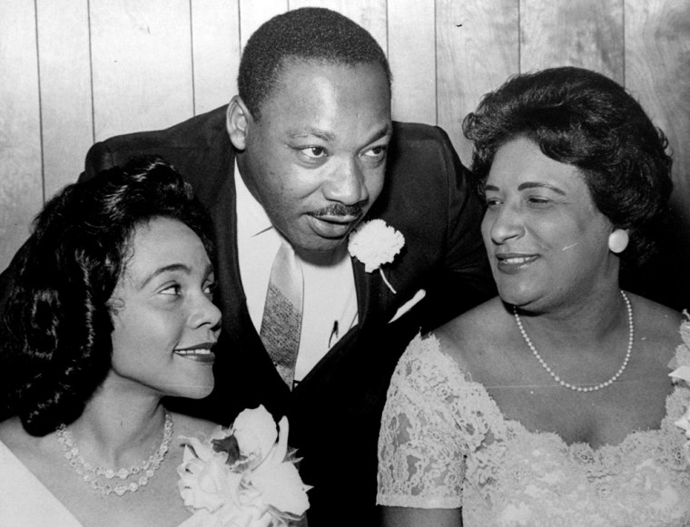 ** FILE ** Dr. Martin Luther King, Jr., president of the Southern Christian Leadership Conference, chats with his wife, Coretta, left, and civil rights champion Constance Baker Motley before the start of an S.C.L.C. banquet in this Aug. 9, 1965 file photo in Birmingham, Ala. Motley, a federal judge who as a young lawyer represented Martin Luther King Jr. and played a pivotal role in reducing racial injustice in America in the 1960s, has died. She was 84.  Motley died Tuesday, Sept. 27, 2005, after a career that in its early days found her fighting blatant racism in many of the nation's landmark segregation cases.  (AP Photo/File)