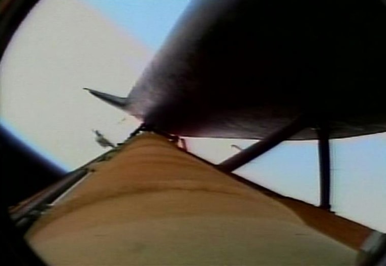 ** FILE ** In this image made from video released by NASA, what appears to be a sizable piece of material is seen coming off the space shuttle Discovery's external fuel tank after lift off, on July 26, 2005. According to NASA, it did not seem to strike the orbiter that carries the seven-member crew. (AP Photo/NASA)