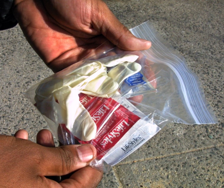 Safer sex kits are handed out by an AIDS education group working with Unity Fellowship Church in Brooklyn, N.Y. Many states across the nation forbid school districts from providing information about sexually transmitted diseases or contraception.