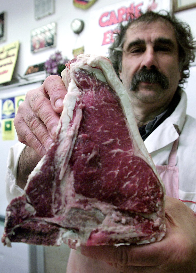 File photo shows Italian butcher holding traditional Florentine beefsteak in Rome