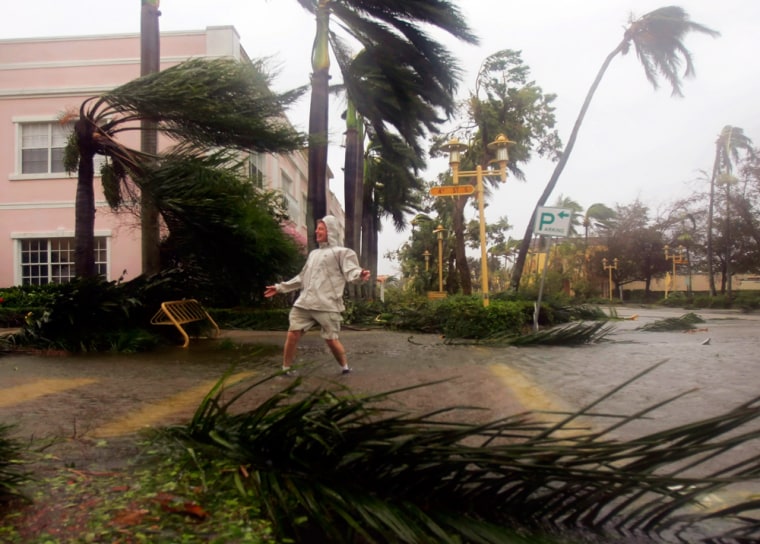 A man plays in the winds on Fifth Avenue in downtown Naples of Florida