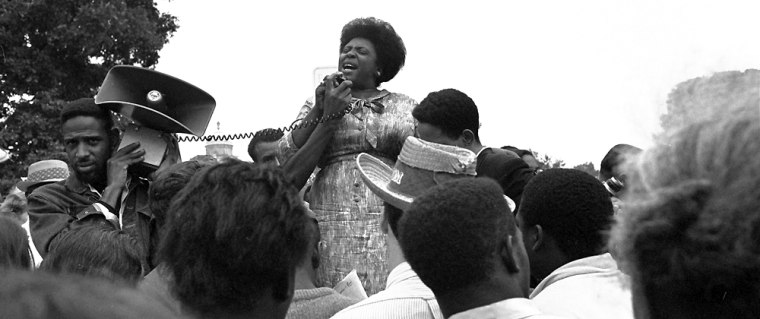 Mrs. Fannie Lou Hamer of Ruleville, Miss., speaks to Mississippi Freedom Democratic Party sympathizers outside the Capitol in Washington after the House of Representatives rejected a challenger to the 1964 election of five Mississippi representatives, in this Sept. 17, 1965 file photo.