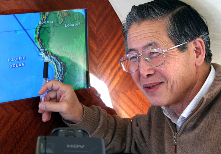 Former Peruvian president Fujimori points to in-flight video showing flight route from Tokyo to Santiago