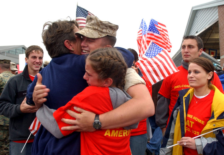 Lance Cpl. Ryan of the Company L, 3rd Battalion, 25th Marine Regiment celebrates with family in Columbus