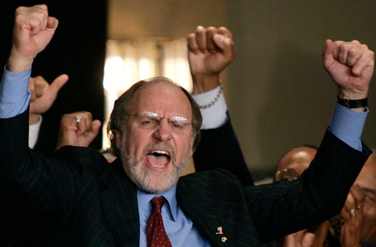 Democratic US Senator Jon Corzine celebrates as he appears at his East Brunswick headquarters
