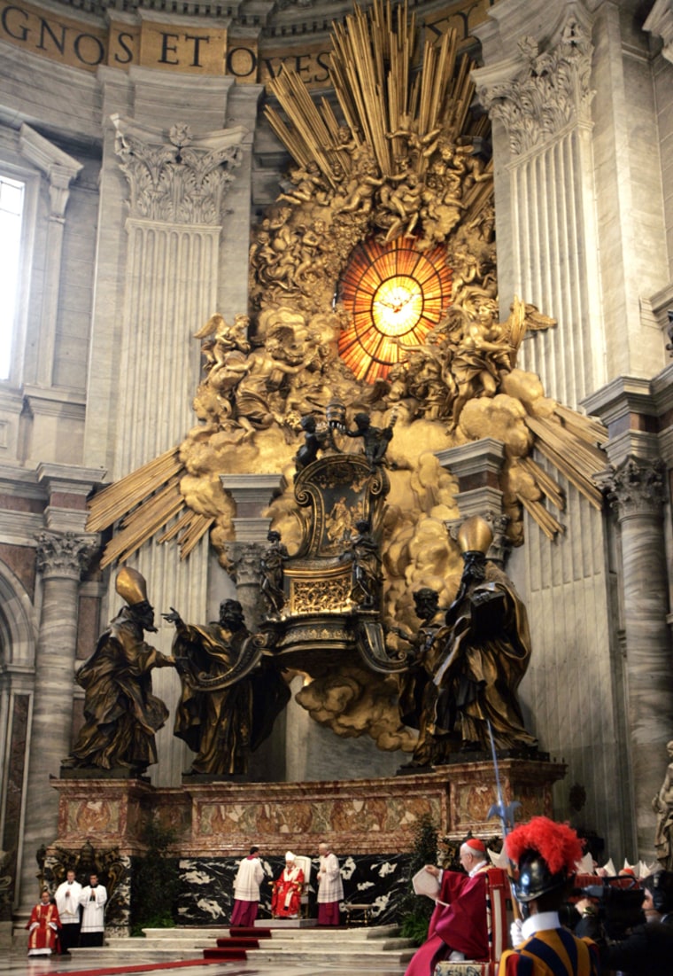 Pope Benedict XVI sits under Bernini's Chair of St. Peter in St. Peter's Basilica at the Vatican as he celebrates a Mass on Friday.