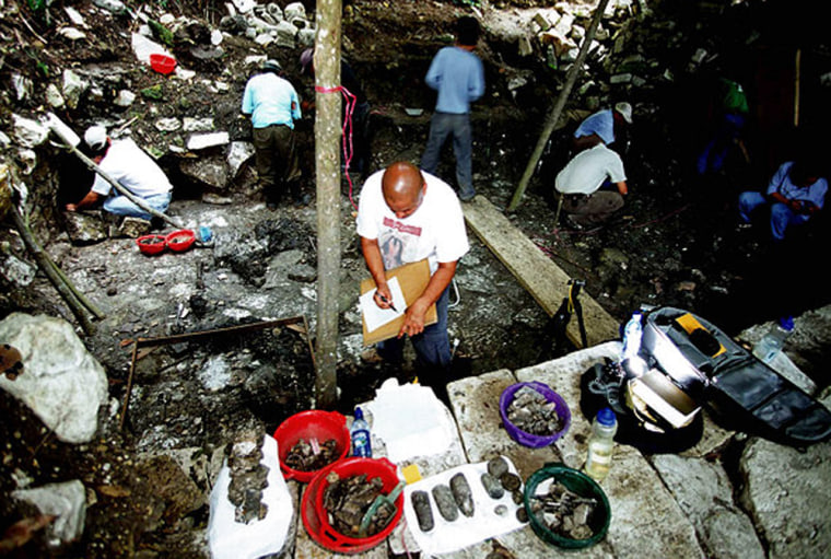 Members of the Forensic Anthropological Foundation of Guatemala excavate at the Mayan mass grave.