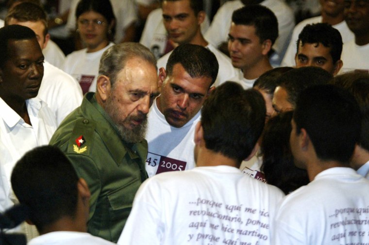 Cuban President Fidel Castro talks to st