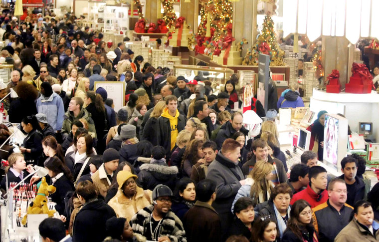 Holiday shoppers make their way through Macy's in New York
