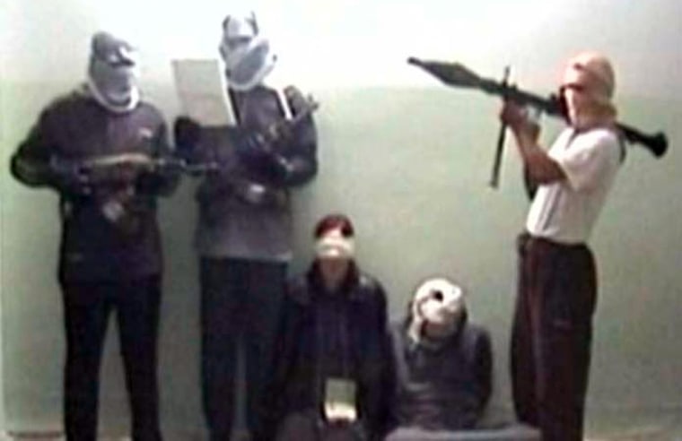 This still from video footage, released by German TV broadcaster ARD on Tuesday, purportedly shows kidnapped German woman Susanne Osthoff, third from left, and her driver, second from right.
