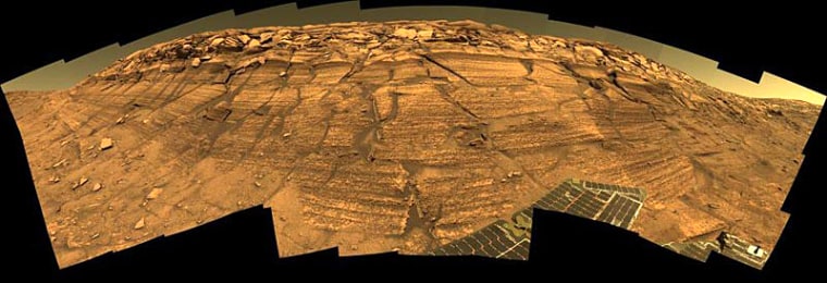 NASA's Opportunity rover captured this view of "Burns Cliff" after driving right to the base of the southeastern portion of the inner wall of Endurance Crater. The view combines frames taken by Opportunity's panoramic camera between Nov. 13 and 20, 2004. 