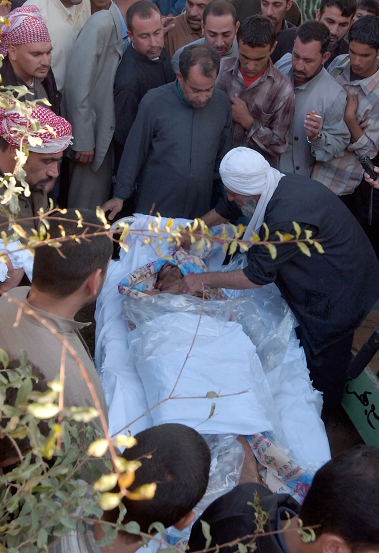 People gather at the coffin of Watheq Abdula, in Baqouba, Iraq, in this Nov. 17 photo. According to relatives, Abula was arrested Nov. 13 by Interior Ministry special forces, and his body was found Nov. 16 in Baqouba. Amnesty International warned a government probe may show a pattern of abuse of prisoners by the Iraqi government. 