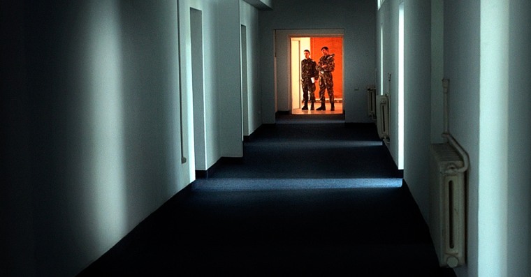 Romanian military staff members stand at the end of a corridor on the Mihail Kogalniceanu airbase, some 250 kilometers east of Bucharest, in this Nov. 9 file photo.The Soviet-era facility has become a key focus of a European investigation into allegations that the CIA operated secret prisons where suspected terrorists were interrogated.
