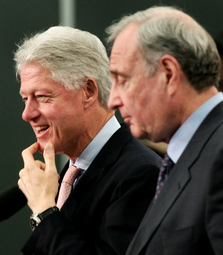 Former US president Clinton reacts during a news conference with Canadian PM Martin in Montreal
