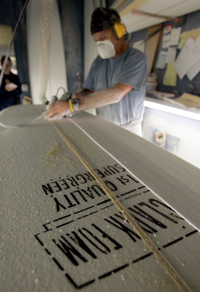 Shaper Geoff Madsen does custom work on a Clark Foam board at Stewart Surfboards in San Clemente, Calif. Clark Foam, which enjoyed a virtual monopoly on the blocks used for customized boards, abruptly closed its doors for good last week.