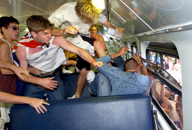 (AUSTRALIA OUT) Youths (L) attack a man