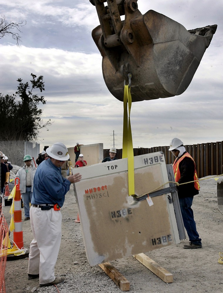 The Army Corps of Engineers removes samples of floodwall material on Monday near the 17th Street Canal levee in New Orleans as part of an investigation to determine why the levee failed.
