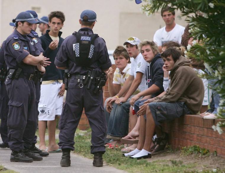 Police talk with teenagers in North Cronulla in Sydney