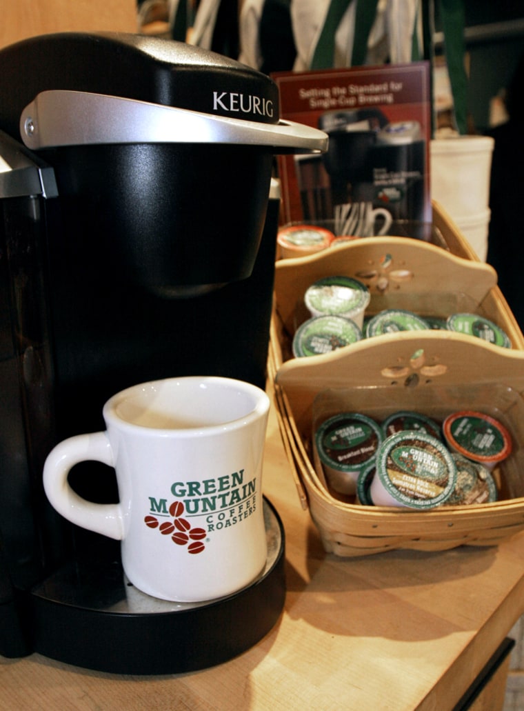 A single-serving coffee maker is seen at the Green Mountain Coffee Roasters outlet store in Waterbury, Vt. The dimunitive cups are a self-contained coffee brewing system that can be popped into a relatively new brand of coffee maker to produce a single cup of steaming java.