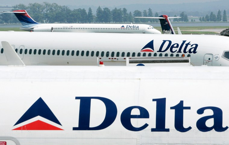 File photo of Delta Airlines jets seen at a terminal at Reagan National Airport outside Washington