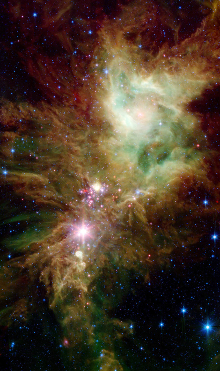 Through small telescopes, the Christmas Tree star cluster looks like a tree bedecked by dazzling holiday lights. Spitzer's new infrared image reveals a different view: ribbons of gas and dust swirling like snow blowing in frigid winter winds and adorned by a festive collection of brilliant stars. A fan-shaped star cluster near the center of the image has been nicknamed the Spokes Cluster, or Snowflake Cluster.