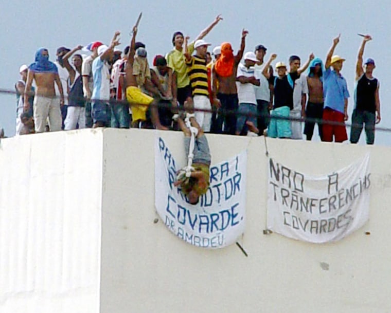 Rioting prisoners shows a hostage at the Urso Branco Penitentiary complex near the Rondonia state capital of Porto Velho