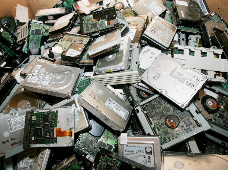 ** ADVANCE FOR WEEKEND EDITIONS OF DEC. 31-JAN. 1 ** Computer hard drives await shredding at Molam International e-cycling in Marietta, Ga., Wednesday, Dec. 28, 2005. Each month one million pounds of electronics are recycled in the warehouse.  (AP Photo/Ric Feld)