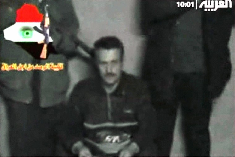 Frame grab shows French engineer Planche with his captors