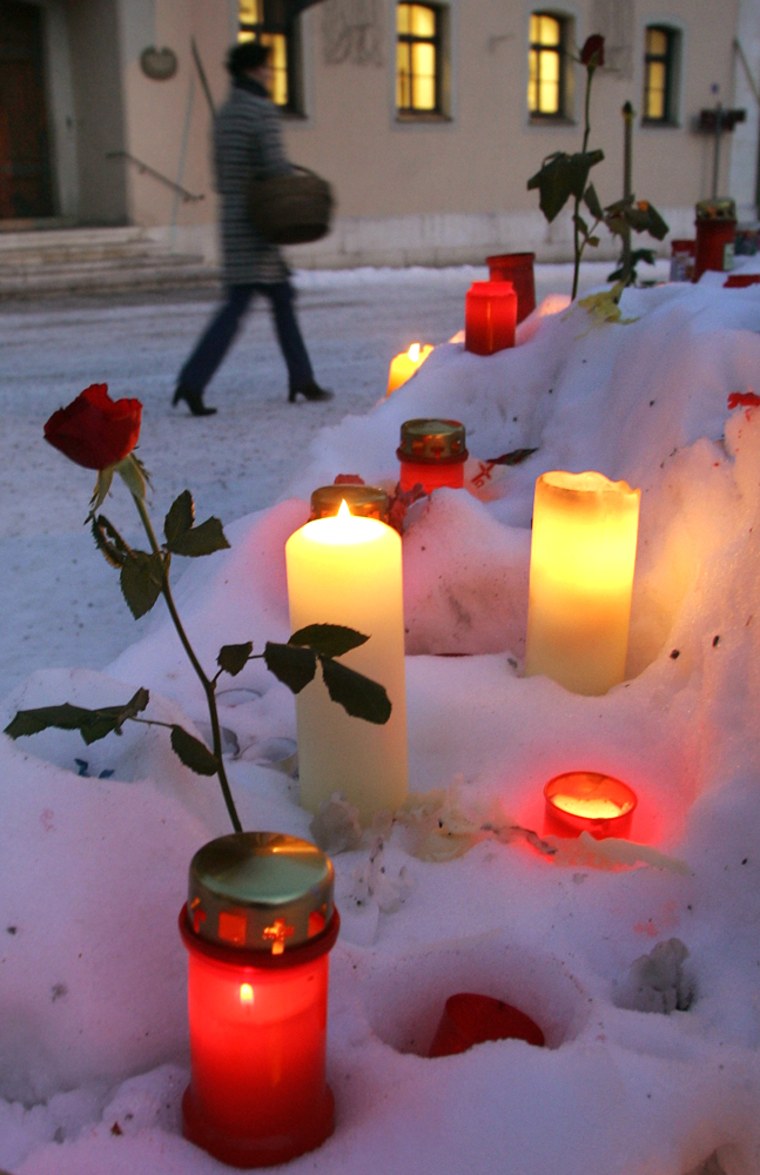 Candles and flowers are placed in front of the town hall of Bad Reichenhall