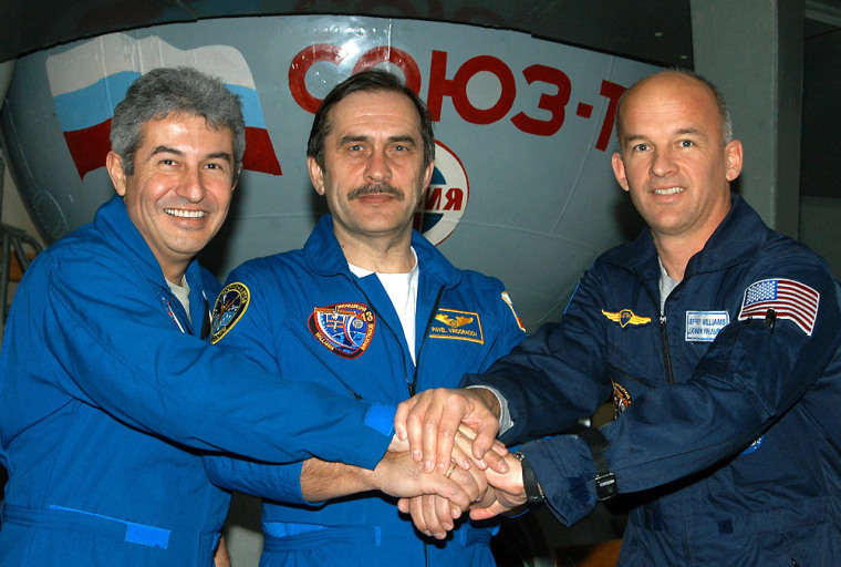 Astronaut Pontes of Brazil, cosmonaut Vinogradov of Russia and astronaut Williams of US pose during their training session in Star City outside Moscow