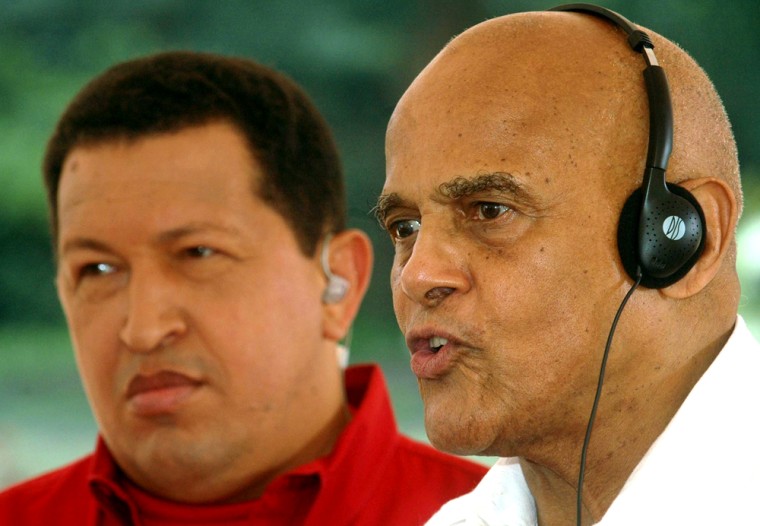 American singer Belafonte speaks as Venezuela's President Chavez looks on during Chavez's weekly broadcast in El Consejo