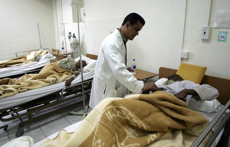 A doctor tends to a wounded Muslim pilgr