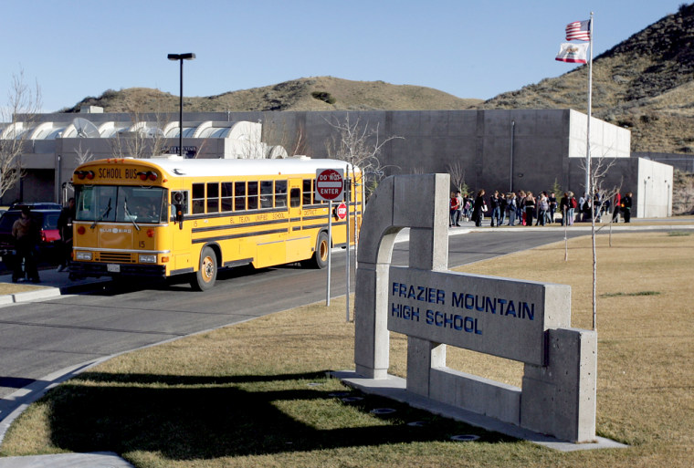 A school bus leaves Frazier Mountain High School in Lebec, Calif.. where a "Philosophy of Design" class had addressed a religion-based alternative to the scientific theory of evolution.