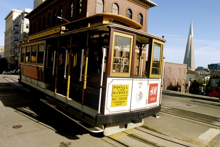 San Francisco Mayor Gavin Newsom has accused some operators of the city's iconic cable cars, like the one shown here, of pocketing cash from passengers.