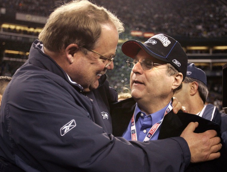 Seahawks coach Holmgren congratulates team owner Allen after winning NFL's NFC Championship game in Seattle