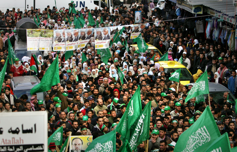 Palestinian supporters of Hamas celebrate their victory in Ramallah in the West Bank on Thursday.