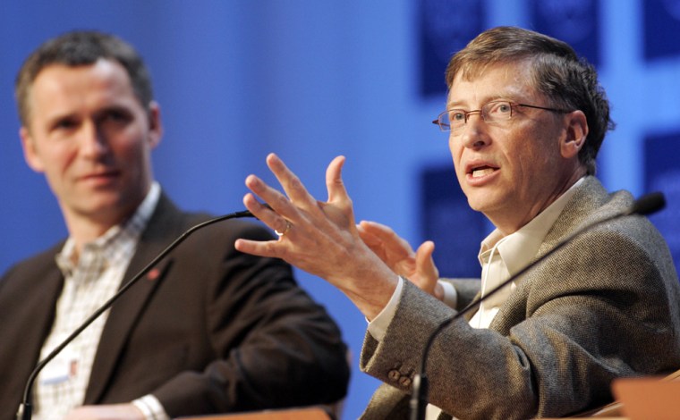 Chairman of Microsoft Corporation Bill Gates, right, gestures while speaking during a plenary entitled 'Not Gone, but Almost Forgotten' at the World Economic Forum in Davos, Switzerland, Friday Jan. 27, 2006. Gates said Friday that his charitable foundation will triple its funding for tuberculosis eradication from US$300 million to US$900 million by 2015. Seated left is Norway's Prime Minister Jens Stoltenberg. (AP Photo/Michel Euler)