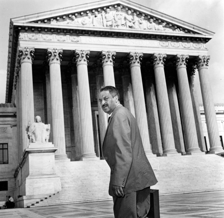 Thurgood Marshall, center, chief legal counsel of the National Association for the Advancement of Colored People, arrives at the Supreme Court Building in Washington, August 22, 1958, to file an appeal in the integration case of Central High School in Little Rock, Arkansas. (AP Photo)