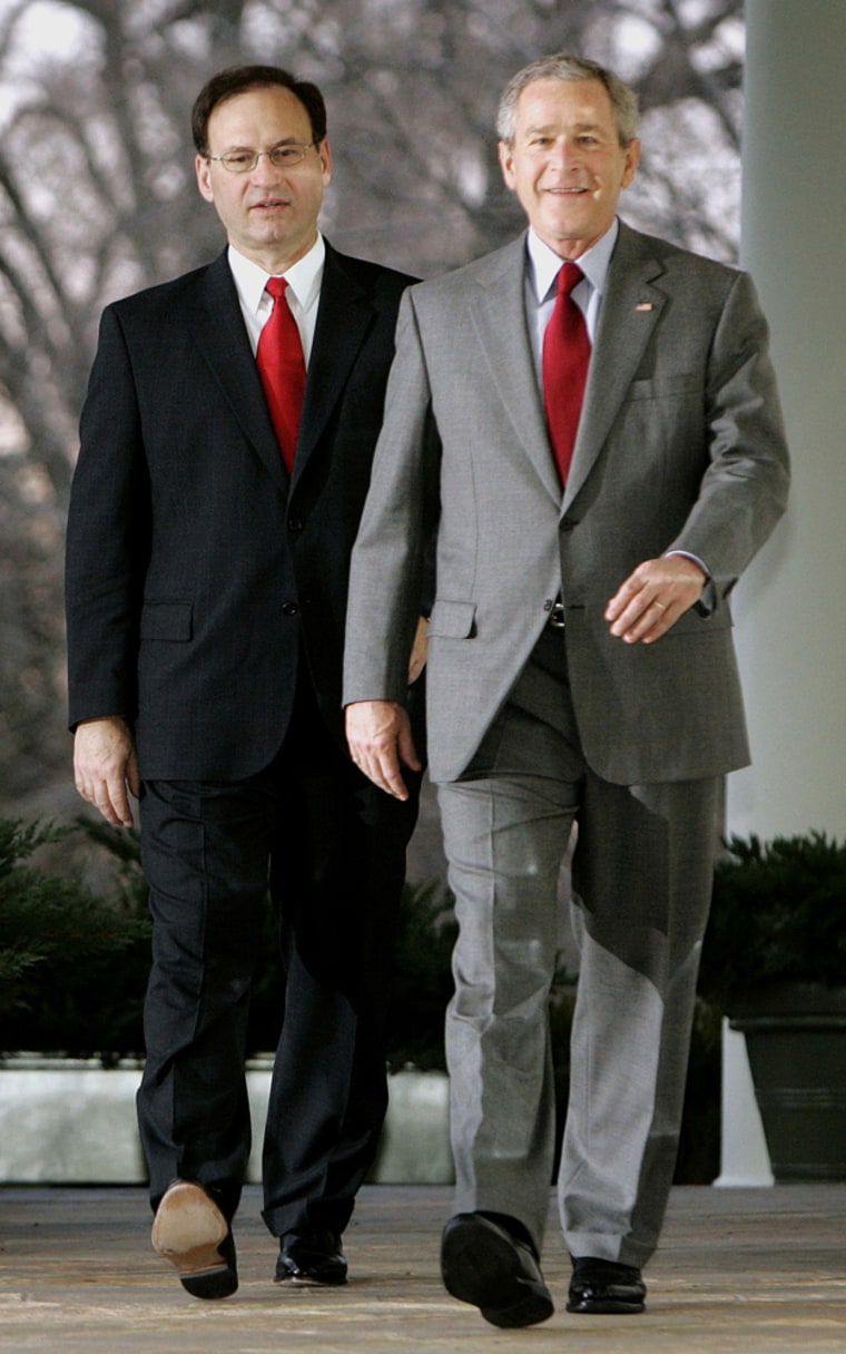 US President Bush walks with Supreme Court justice nominee Alito into Rose Garden of White House