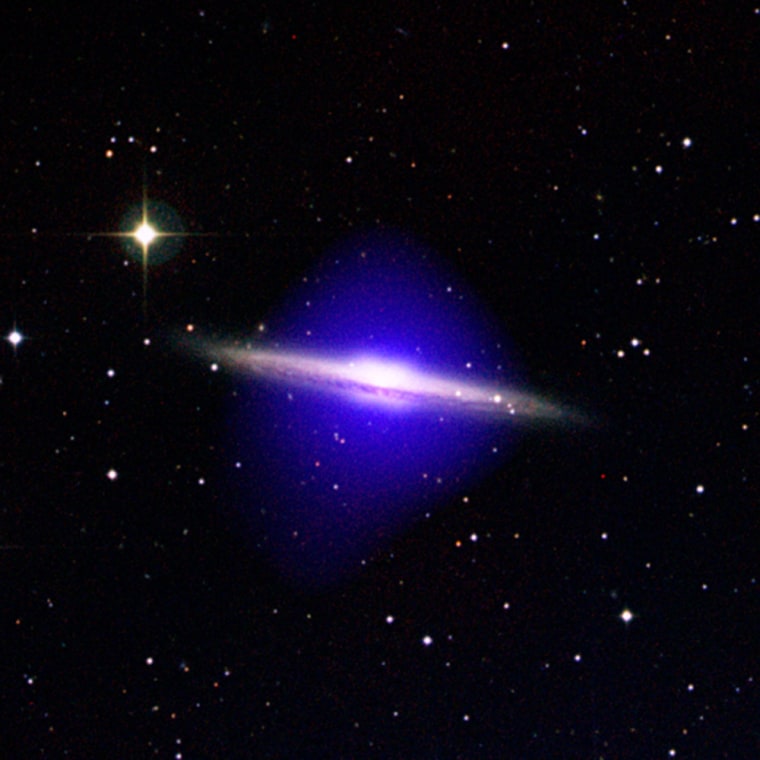 A halo of hot, infalling gas shows up as a blue haze in this color-coded image of NGC 5746. The image blends an optical view of the galaxy with data from NASA's Chandra X-ray Observatory.